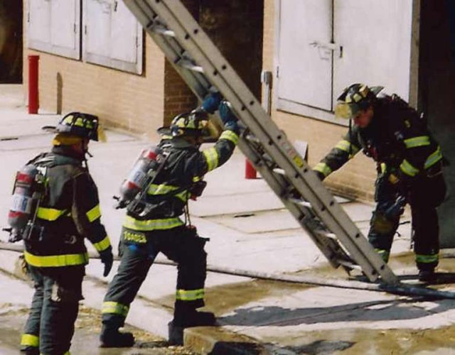 Raising a ladder at the Taxpayer Building at Middlesex County Fire Academy.